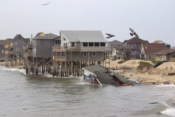 An unoccupied, privately owned house in Rodanthe, N.C., just south of Rodanthe Pier, collapsed into the ocean early Tuesday morning, May 28, 2024. (Corinne Saunders/The Virginian-Pilot via AP)