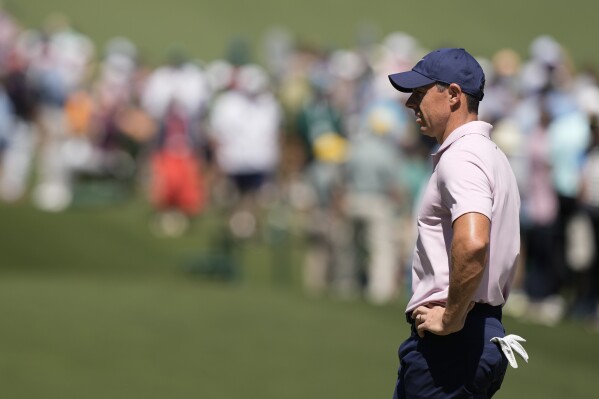 Rory McIlroy, of Northern Ireland, waits to play on the seventh hole during third round at the Masters golf tournament at Augusta National Golf Club Saturday, April 13, 2024, in Augusta, Ga. (AP Photo/Charlie Riedel)