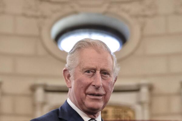 FILE - In this Wednesday, March 29, 2017 file photo, Britain's Prince Charles smiles during a welcoming ceremony at the Cotroceni Presidential Palace in Bucharest, Romania. Prince Charles has been preparing for the crown his entire life. Now, that moment has finally arrived. Charles, the oldest person to ever assume the British throne, became king on Thursday Sept. 8, 2022, following the death of his mother, Queen Elizabeth II.  (AP Photo/Vadim Ghirda, File)