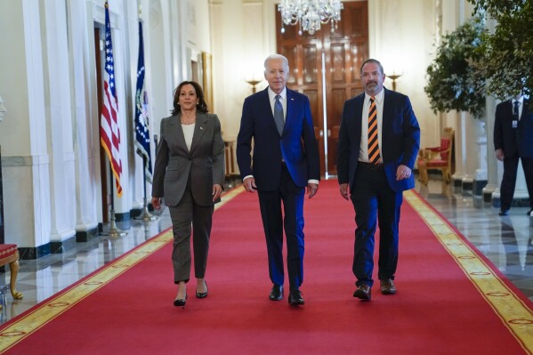 Vice President Kamala Harris, President Joe Biden, and Jeff Say arrive for an event about high speed internet infrastructure, in the East Room of the White House, Monday, June 26, 2023, in Washington. (AP Photo/Evan Vucci)