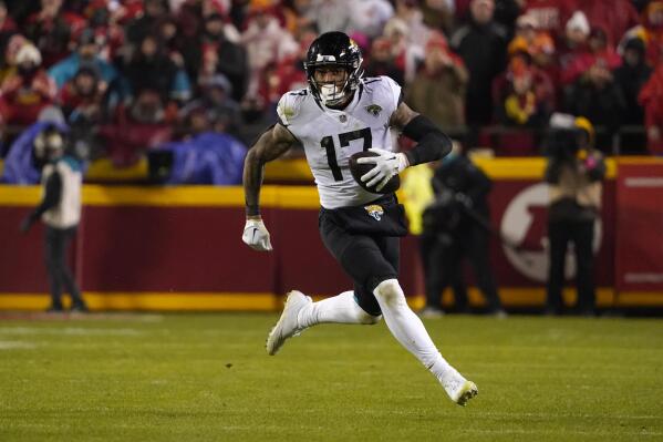 FILE - Jacksonville Jaguars tight end Evan Engram runs during an NFL Divisional Playoff football game against the Kansas City Chiefs, Saturday, Jan. 21, 2023, in Kansas City, Mo. Engram will be back in Jacksonville for another season, probably longer if the Jaguars get their way. The Jaguars placed the franchise tag on the veteran tight end Monday, March 6, 2023, guaranteeing him a one-year, $11.345 million contract for 2023.(AP Photo/Ed Zurga, File)