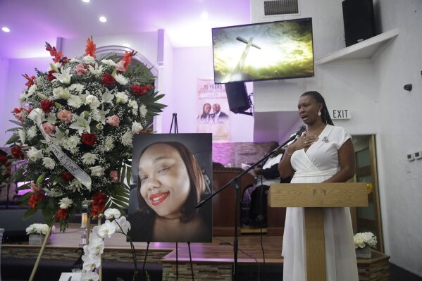 Erika Banks cries as she eulogizes her sister Lydia Nunez, who died from COVID-19, during a funeral service in memory of Nunez at the Metropolitan Baptist Church Tuesday, July 21, 2020, in Los Angeles. (AP Photo/Marcio Jose Sanchez)