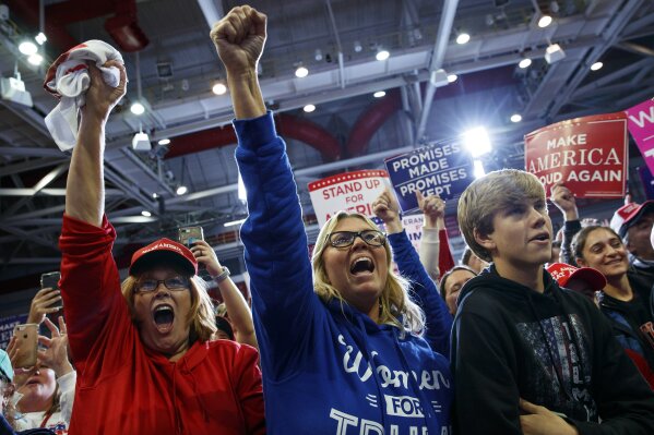 
              Supporters of President Donald Trump cheer as the president arrives to speak during a rally at Show Me Center, Monday, Nov. 5, 2018, in Cape Girardeau, Mo.. (AP Photo/Carolyn Kaster)
            