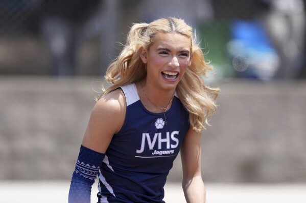 AB Hernandez of Jurupa Valley smiles while completing in the girls long jump during the CIF Southern Section Masters Meet at Moorpark High School, Saturday, May 24, 2025, in Moorpark, Calif. (Kirby Lee via AP)