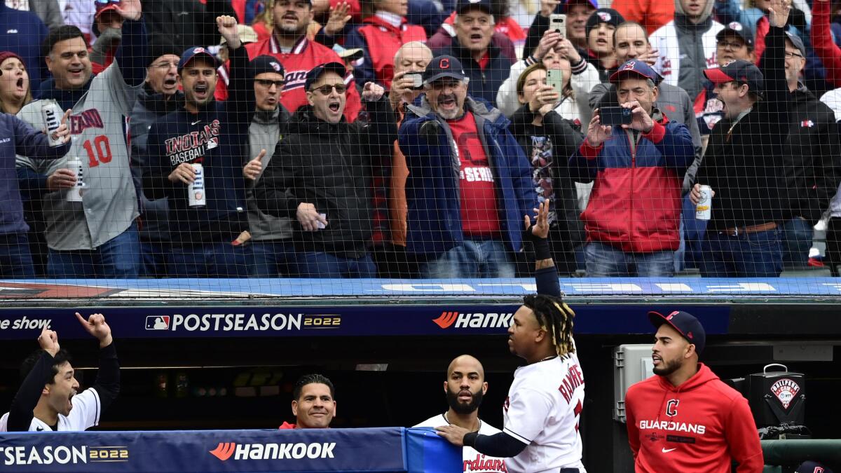 Cleveland Guardians fans cheer before a wild card baseball playoff