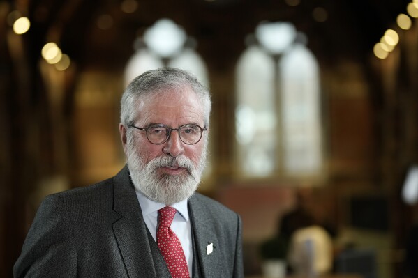 FILE - Former President of Sinn Fein, Gerry Adams, speaks during an interview on the first day of a three-day international conference at Queen's University Belfast, Northern Ireland, on April 17, 2023. Former Sinn Fein leader Gerry Adams faces a lawsuit by three people who were wounded in bombings attributed to the Irish Republican Army that date back more than 50 years, a judge said Friday. Adams can be held personally liable but not as a representative of the group, Justice Michael Soole ruled. (AP Photo/Christophe Ena, File)