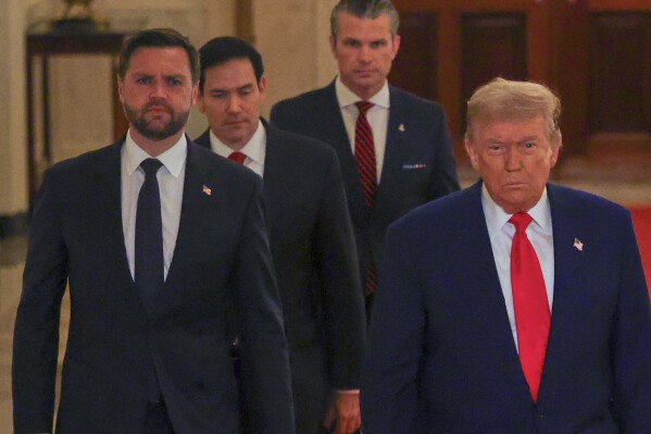 President Donald Trump arrives with Vice President JD Vance, Secretary of State Marco Rubio and Defense Secretary Pete Hegseth to speak from the East Room of the White House in Washington, Saturday, June 21, 2025, after the U.S. military struck three Iranian nuclear and military sites, directly joining Israel's effort to decapitate the country's nuclear program. (Carlos Barria/Pool via AP)