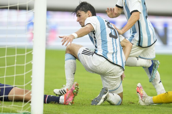 Argentina's Federico Redondo celebrates after he scored his team's third goal against Paraguay during South America's under-23 pre-Olympic tournament soccer match at Brigido Iriarte stadium in Caracas, Venezuela, Thursday, Feb. 8, 2024. (AP Photo/Matias Delacroix)