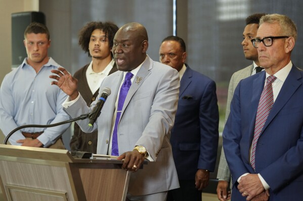 Standing with former Northwestern athletes, attorney Ben Crump speaks during a press conference addressing widespread hazing accusations at Northwestern University Wednesday, July 19, 2023, in Chicago. (AP Photo/Erin Hooley)