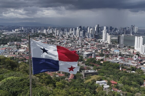 A Panamanian flag flies on Ancon hill backdropped by the skyline of Panama City, Thursday, May 2, 2024. Panamanians will elect a new president on May 5th. (AP Photo/Matias Delacroix)
