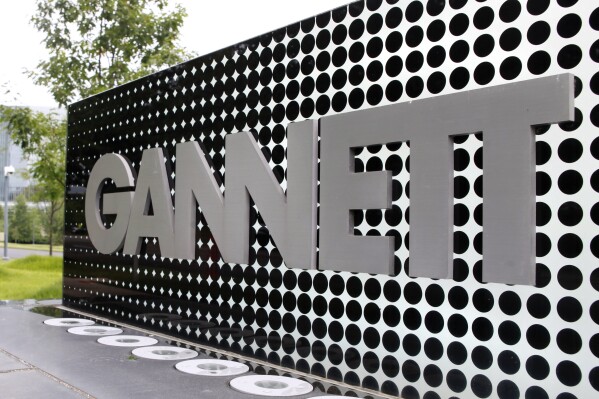 FILE - The Gannett Co. headquarters sign is seen, July 14, 2010, in McLean, Va. The media company Gannett, publishers of USA Today and owner of the nation's largest newspaper chain, said Tuesday, March 19, 2024, that it would stop using journalism from The Associated Press later this month, severing a century-old partnership. (AP Photo/Jacquelyn Martin, File)