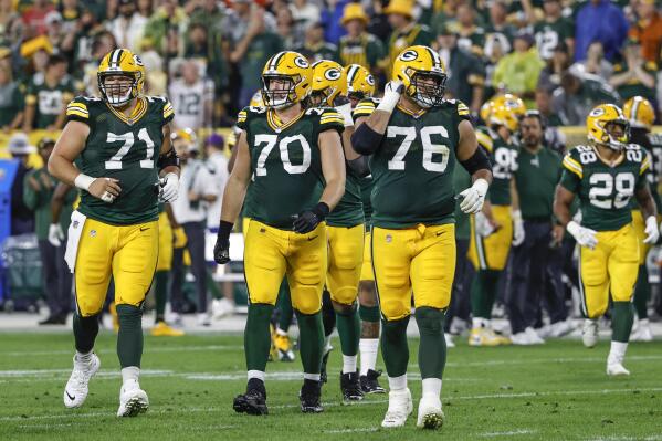 Green Bay Packers center Josh Myers (71), offensive guard Royce Newman (70) and offensive guard Jon Runyan (76) walk on the field during the second half of an NFL football game against the Detroit Lions, Monday, Sept. 20, 2021, in Green Bay, Wis. (AP Photo/Kamil Krzaczynski)