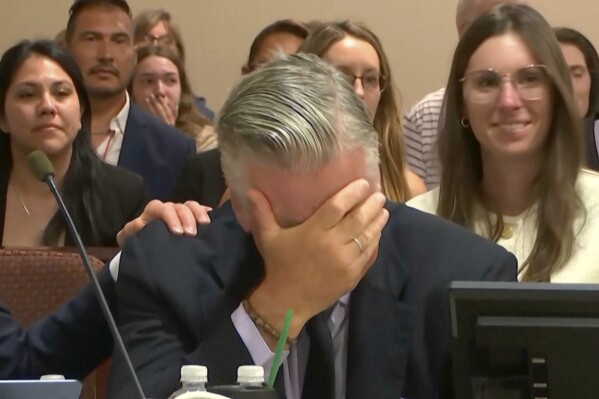 Actor Alec Baldwin reacts after the judge threw out the involuntary manslaughter case for the 2021 fatal shooting of cinematographer Halyna Hutchins during filming of the Western movie "Rust," Friday, July 12, 2024, at Santa Fe County District Court in Santa Fe, N.M. (Pool Video via AP)