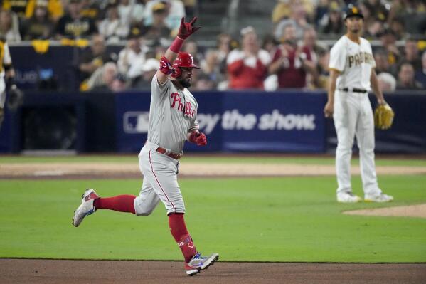 Philadelphia Phillies' Kyle Schwarber celebrates his home run after San Diego Padres starting pitcher Yu Darvish during the sixth inning in Game 1 of the baseball NL Championship Series between the San Diego Padres and the Philadelphia Phillies on Tuesday, Oct. 18, 2022, in San Diego. (AP Photo/Ashley Landis)