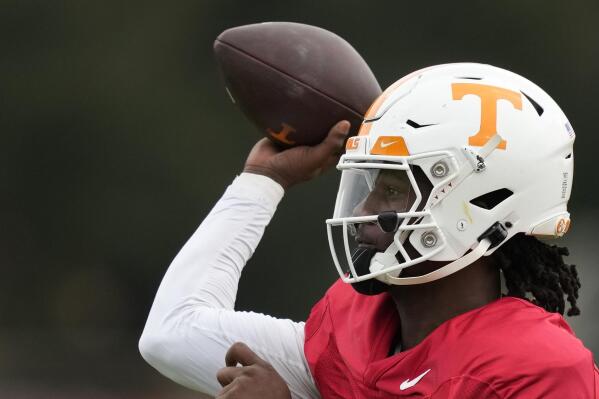 Tennessee Volunteers quarterback Joe Milton III (7) throws a pass during a practice session ahead of the 2022 Orange Bowl, Tuesday, Dec. 27, 2022, in Miami Shores, Fla. Tennessee will face the Clemson Tigers in the Orange Bowl on Friday, Dec. 30.(AP Photo/Rebecca Blackwell)