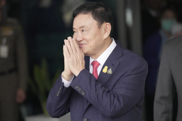 FILE - Thailand's former Prime Minister Thaksin Shinawatra arrives at Don Muang airport in Bangkok, Thailand, on Aug. 22, 2023. Thaksin, who recently returned from exile and began serving an eight-year prison term, has requested a royal pardon, a senior member of the outgoing Cabinet said Thursday, Aug. 31. Thaksin was moved from prison to a state hospital soon after his return last week for reported ill health. (AP Photo/Sakchai Lalit, File)