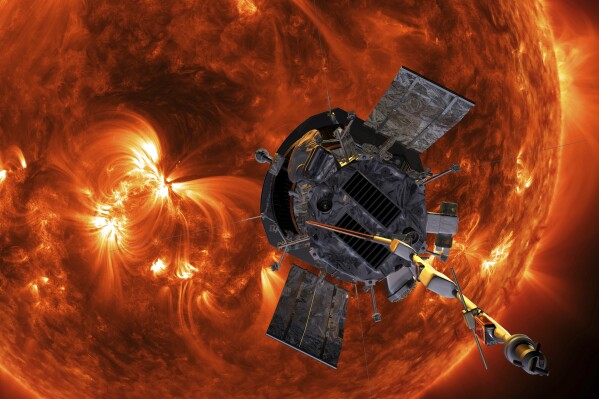 This image made available by NASA shows an artist's rendering of the Parker Solar Probe approaching the Sun. It's designed to take solar punishment like never before, thanks to its revolutionary heat shield that's capable of withstanding 2,500 degrees Fahrenheit (1,370 degrees Celsius). (Steve Gribben/Johns Hopkins APL/NASA via AP, File)