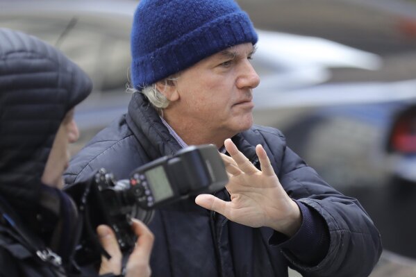 
              Gregory Abbott, founder and chairman of International Dispensing Corporation, leaves after appearing in federal court in New York on bribery charges, Tuesday, March 12, 2019. Abbott is among dozens of people who were charged Tuesday in a scheme in which wealthy parents allegedly bribed college coaches and other insiders to get their children into some of the nation's most elite schools. (AP Photo/Bebeto Matthews)
            