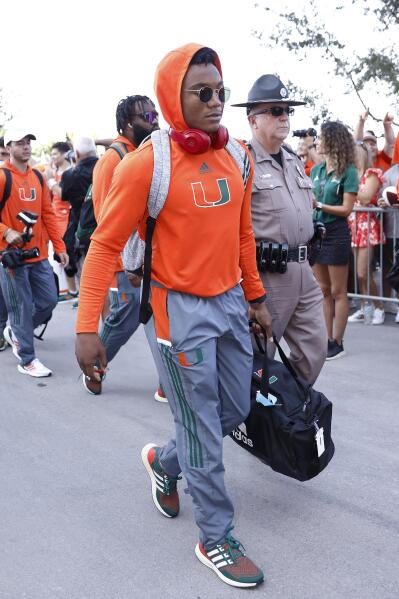 Miami Hurricanes quarterback D'Eriq King (1) arrives on the Hurricane Walk before the start of an NCAA college football game against Michigan State, Saturday, Sept. 18, 2021, in Miami Gardens, Fla. (AP Photo/Michael Reaves)