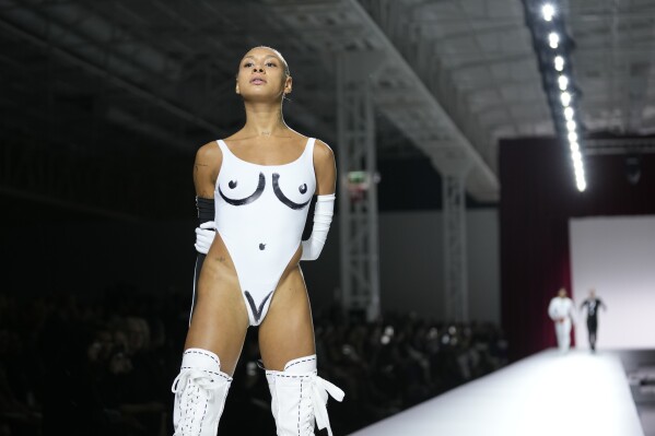 A model wears a creation as part of the Moschino women's Spring Summer 2024 collection presented in Milan, Italy, Thursday, Sept. 21, 2023. (AP Photo/Antonio Calanni)