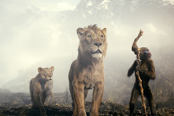 This image released by Disney shows characters Sarabi, voiced by Tiffany Boone, left, Mufasa, voiced by Aaron Pierre, center, and Rafiki, voiced by Kagiso Lediga in a scene from "Mufasa: The Lion King." (Disney via AP)
