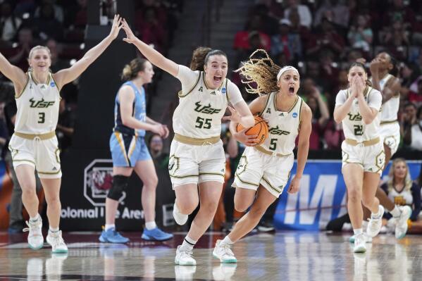 South Florida guard Carla Brito (55), Elena Tsineke (5), Sammie Puisis (3), and Aerial Wilson (22) react after a missed shot by Marquette at the end of overtime in a first-round college basketball game in the NCAA Tournament, Friday, March 17, 2023, in Columbia, S.C. South Florida beat Marquette 67-65. (AP Photo/Sean Rayford)
