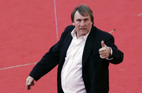 French actor Gerard Depardieu poses for photographers on the red carpet of the Rome Film Festival, on Oct. 21, 2007. (AP Photo/Riccardo De Luca, File)