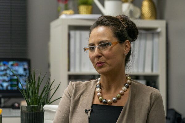 Dorota Mani sits for an interview in her office in Jersey City, N.J. on Wednesday, Nov. 8, 2023. Mani is the parent of a 14-year-old Westfield High School student victimized by an AI-generated deepfake image. (AP Photo/Peter K. Afriyie)