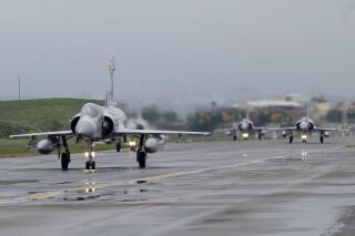 FILE - Taiwanese Mirage 2000 fighter jets taxi along a runway during a drill at an airbase in Hsinchu, Taiwan, Wednesday, Jan. 11, 2023. Taiwan scrambled fighter jets, put its navy on alert and activated missile systems Tuesday, Jan. 31, 2023, in response to nearby operations of 34 Chinese military aircraft and nine warships that are part Beijing's strategy to unsettle and intimidate the self-governing island democracy. (AP Photo/Johnson Lai, File)