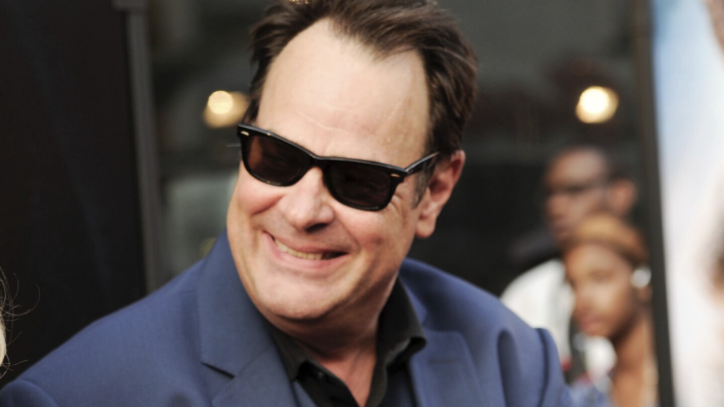 FILE - Dan Aykroyd attends the world premiere of "Get On Up" in New York on July 21, 2014. Aykroyd writes and narrates the Audible Original “Blues Brothers: The Arc of Gratitude,” which starts with him meeting John Belushi in 1973. (Photo by Evan Agostini/Invision/AP, File)