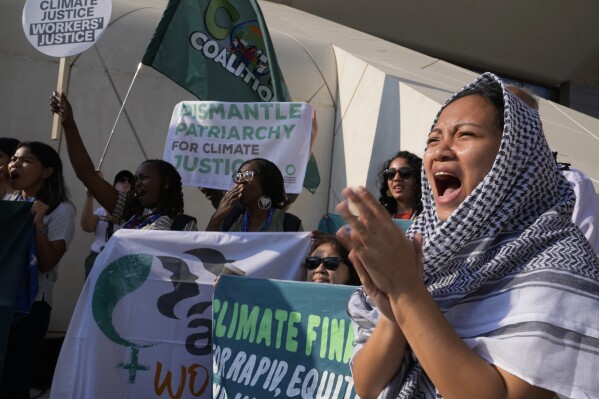 Activists demonstrate during the COP28 U.N. Climate Summit, Saturday, Dec. 9, 2023, in Dubai, United Arab Emirates. (AP Photo/Kamran Jebreili)