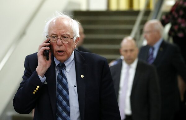 
              Sen. Bernie Sanders, I-Vt., talks on his phone as he departs after a vote on Gina Haspel to be CIA director, on Capitol Hill, Thursday, May 17, 2018 in Washington. The Senate confirmed Haspel as the first female director of the CIA following a difficult nomination process that reopened an emotional debate about brutal interrogation techniques in one of the darkest chapters in the spy agency's history. (AP Photo/Alex Brandon)
            