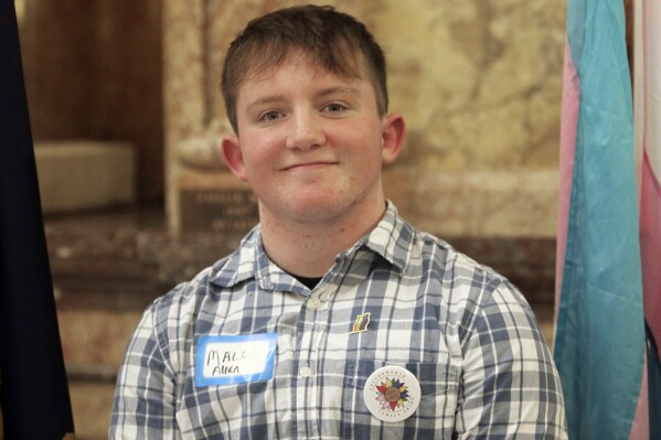 Mack Allen, of Leavenworth, Kan., poses following a rally for LGBTQ youth at the Statehouse, Wednesday, Jan. 31, 2024, in Topeka, Kan. A Kansas law enacted in 2023 ended the state's legal recognition of transgender identities, and now other states are considering such laws. (AP Photo/John Hanna)