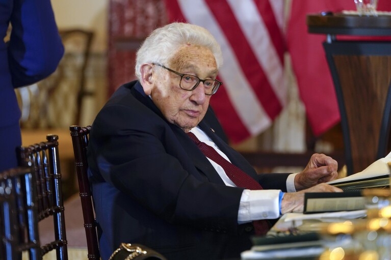FILE - Former U.S. Secretary of State Henry Kissinger attends a luncheon with French President Emmanuel Macron, Vice President Kamala Harris and Secretary of State Antony Blinken, Thursday, Dec. 1, 2022, at the State Department in Washington. The former secretary of state exerted uncommon influence on global affairs under Presidents Richard Nixon and Gerald Ford, earning both vilification and the Nobel Peace Prize died Nov. 29, 2023. (AP Photo/Jacquelyn Martin, File)