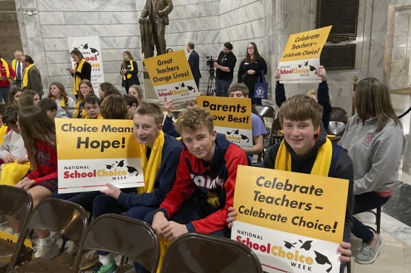 Students attend a school choice rally at the Kentucky Capitol on Thursday, Jan. 25, 2024, in Frankfort, Ky. School choice supporters are pushing for a constitutional amendment that would sanction state support for charter or private schools. (AP Photo/Bruce Schreiner)