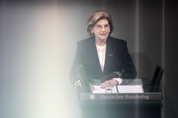 Holocaust survivor Eva Szepesi speaks to the plenary of the German Bundestag in Berlin, Germany, Wednesday, Jan. 31, 2024. The German parliament remembers the victims of National Socialism at a Ceremony of Remembrance at the Reichstag in Berlin. (AP Photo/Ebrahim Noroozi)