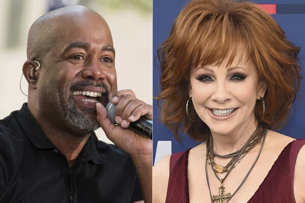 This combination photo shows Darius Rucker performing on NBC's "Today" show in New York on May 25, 2018, left, and Reba McEntire  at the 54th annual Academy of Country Music Awards in Las Vegas on April 7, 2019. McEntire and Rucker are promising laughs and good music when they co-host this year’s CMA Awards in November. McEntire is a veteran of awards show hosting, while Rucker will be a first-time host when the show airs on Nov. 11 on ABC from Nashville, Tenn. (AP Photo)