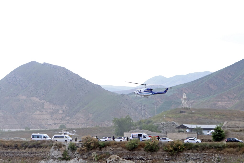 In this photo provided by Islamic Republic News Agency, IRNA, the helicopter carrying Iranian President Ebrahim Raisi takes off at the Iranian border with Azerbaijan after President Raisi and his Azeri counterpart Ilham Aliyev inaugurated dam of Qiz Qalasi, or Castel of Girl in Azeri, Iran, Sunday, May 19, 2024. (Ali Hamed Haghdoust/IRNA via AP)