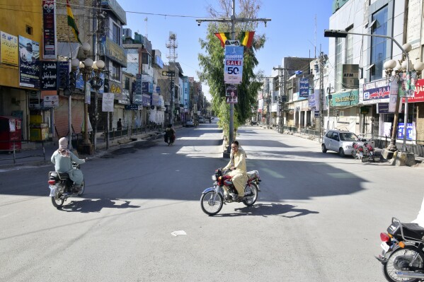 Pakistani people closed their shops during protest against the Mastung bombing alleging that the government's indifference caused the heavy loss of lives in Quetta, Pakistan, Sunday, Oct. 1, 2023. A suspected suicide bomber blew himself up among a crowd of people celebrating the Prophet Muhammad's birthday in southwestern Pakistan on Friday, killing more then 50 people and wounding dozens others, authorities said, in one of the country's deadliest attacks targeting civilians in months. (AP Photo/Arshad Butt)