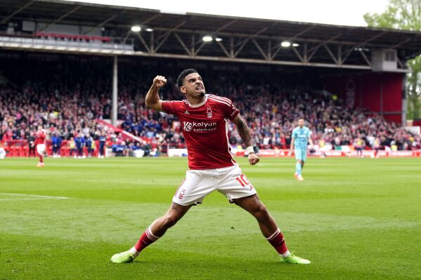 Nottingham Forest's Gibbs-White celebrates his side's first goal of the game during the Premier League soccer match between Nottingham Forest and Wolverhampton Wanderers at the City Ground, in Nottingham, England, Saturday April 13, 2024. (Nick Potts/PA via AP)