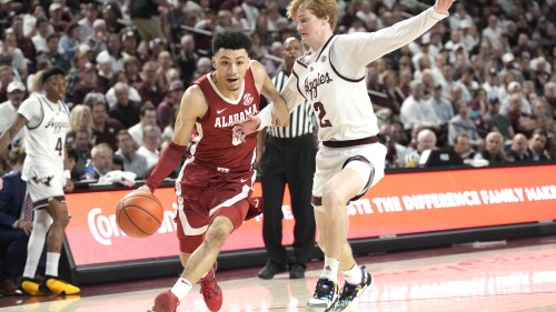 FILE - Alabama guard Jahvon Quinerly (5) drives past Texas A&M guard Hayden Hefner (2) during the second half of an NCAA college basketball game Saturday, March 4, 2023, in College Station, Texas. Quinerly announced his plans to leave the Crimson Tide Sunday night, June 25, on social media after opting to return instead of following teammates Brandon Miller, Noah Clowney and Charles Bediako into the NBA draft. (AP Photo/Sam Craft, File)