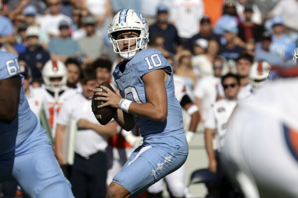 North Carolina quarterback Drake Maye (10) looks to pass against Syracuse during the first half of an NCAA college football game Saturday, Oct. 7, 2023, in Chapel Hill, N.C. (AP Photo/Chris Seward)
