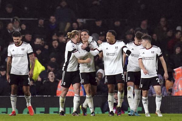 Fulham's Joao Palhinha celebrates scoring their side's second goal of the game with team-mates during the Premier League match between Fulham and Southampton' at Craven Cottage, London, Saturday Dec. 31, 2022. (John Walton/PA via AP)