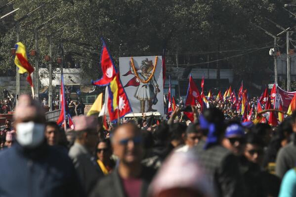 People participate in a rally to mark the birth anniversary of King Prithvi Narayan Shah, who started the Shah dynasty in the 18th century, in Katmandu, Nepal, Wednesday, Jan. 11, 2023. Thousands of supporters of Nepal’s former royal family held a rally Wednesday demanding the restoration of monarchy in the Himalayan nation. The last Shah king, Gyanendra, was forced to step down and the monarchy abolished in 2008, making Nepal a republic. (AP Photo/Bikram Rai)