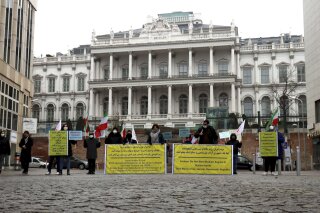 Members of the 'Council of Resistance of Iran' demonstrate in Vienna, Austria, Wednesday, Dec. 16, 2020 for the reactivation of the sanctions resolutions of the UN Security Council against Iran. A bilateral meeting as part of the nuclear talks with Iran is taking place in Austria. (AP Photo/Ronald Zak)