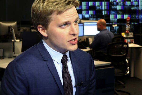 FILE - In this Friday, July 27, 2018, file photo, Ronan Farrow, a contributing writer for the New Yorker, speaks with reporters at The Associated Press headquarters in New York. Farrow accepted a Mirror Award for media reporting from Syracuse University, Thursday, June 13, 2019, by paying tribute to journalists and industry leaders at a Manhattan luncheon for keeping the media honest and transparent. (AP Photo/Ted Shaffrey, File)