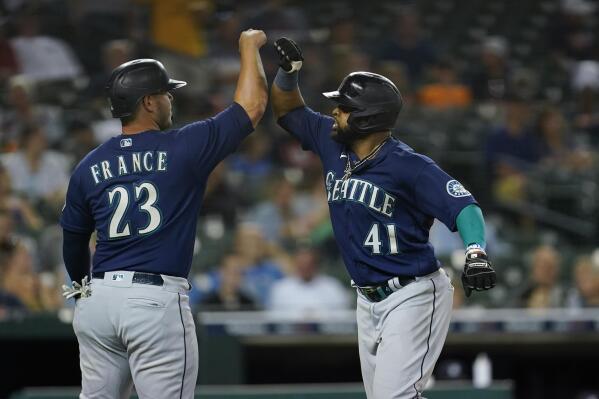 Ty France of the Seattle Mariners celebrates scoring a run with