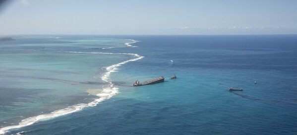 This photo provided by the French Defense Ministry shows oil leaking from the MV Wakashio, a bulk carrier ship that recently ran aground off the southeast coast of Mauritius,, Sunday Aug.9, 2020. T...