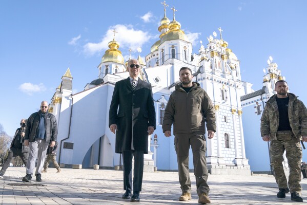 FILE – U.S. President Joe Biden walks with Ukrainian President Volodymyr Zelenskyy in Kyiv, Ukraine, Monday, Feb. 20, 2023. As chances rise of a Biden-Donald Trump rematch in the U.S. presidential election race, America’s allies are bracing for a bumpy ride, with concerns rising that the U.S. could grow less dependable regardless of who wins. (AP Photo/ Evan Vucci, File)