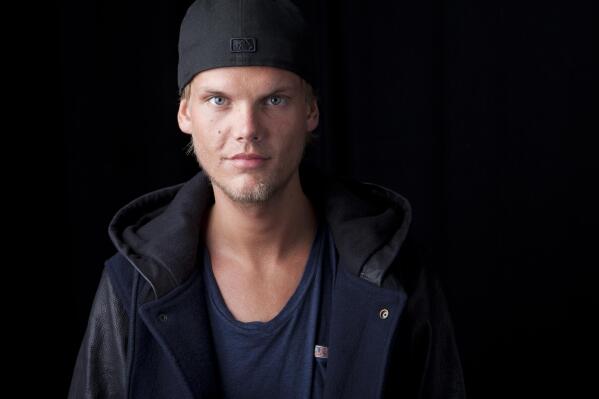 FILE - Swedish DJ, remixer and record producer Avicii poses for a portrait, in New York on Aug. 30, 2013. The indoor arena in Stockholm, which first opened in 1989, is being renamed AVICII ARENA. Avicii, born Tim Bergling, died at age 28 in 2018 by suicide. (Photo by Amy Sussman/Invision/AP, File)